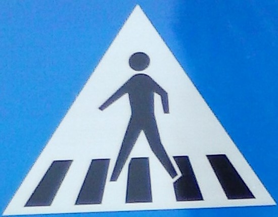 Crosswalk sign, illustrating a mapped-out path for resolving a moral dilemma.